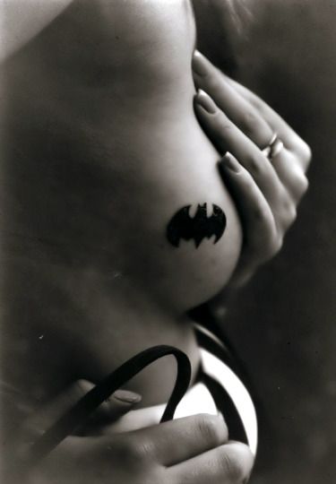 Tattoos On Breasts. Or the big Batman back tattoo.