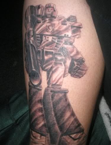  his Megatron Transformers tattoo… along with an exuberant description.