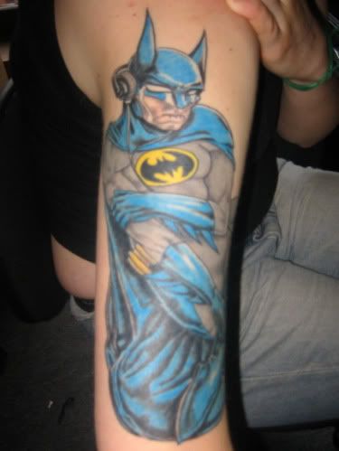 JJ sent me an awesome photo and description of her Batman tattoo that are