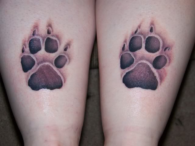 Sophie's paw prints tattooed on my calves just above my ankles.
