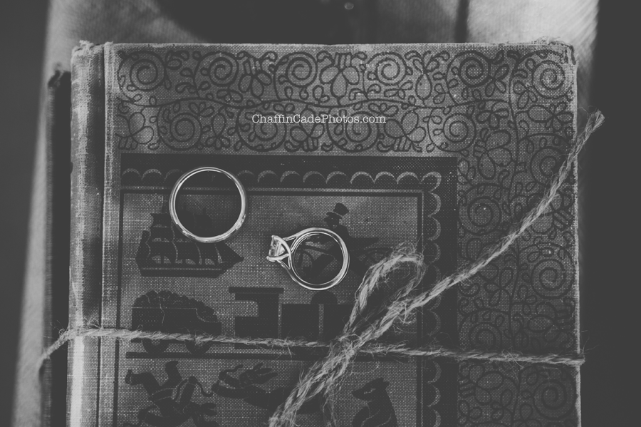 a detailed shot of the bride and groom wedding rings on top of a vintage book at the Las Virgenes Open Space Preserve