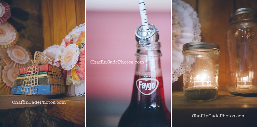 vintage books wrapped in burlap ribbon, intricate colorful fans and mason jars with candles really made this camp wedding unique