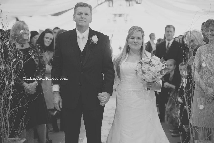 Ginger gets emotional as her dad walks her down the aisle at the camp lodge