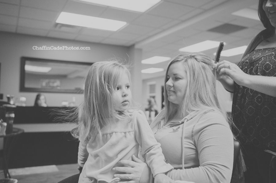 a black and white shot of Ginger at the salon as she gets ready for her wedding day