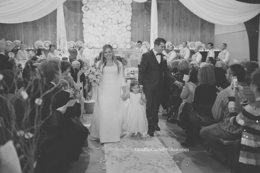 Ginger, Mike and Cali walk back down the aisle, now one big happy family!