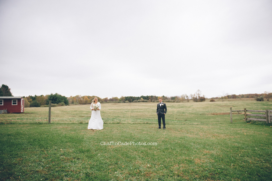 a wide shot of Ginger and Mike, while Ginger holds her bouquet and Mike has his hands in his pockets