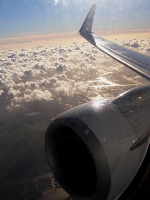 011207wingplaneandclouds.jpg