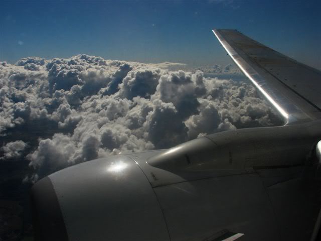 wingplaneandclouds.jpg